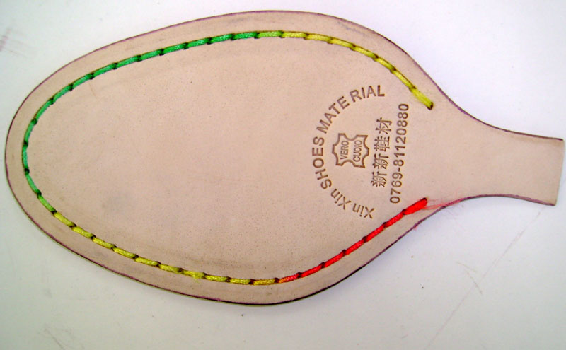 Natural colored leather sole sewed with colorful thread